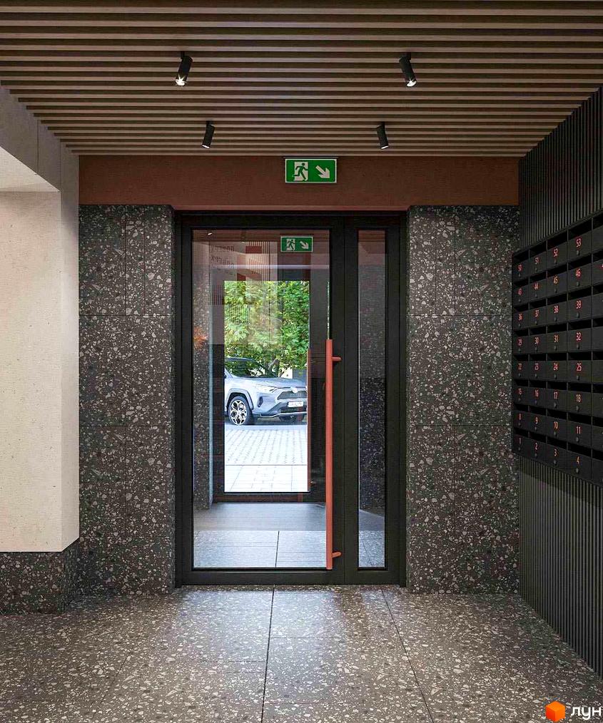 Вхідна група житлового комплексу Незалежність з дверима та поштовими скриньками. Зовнішній вигляд новобудови.