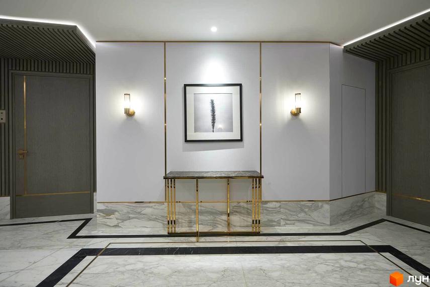 Сучасний хол Linden Luxury Residences з мармуровою підлогою та елегантними бра. Дизайн інтер'єру новобудови.