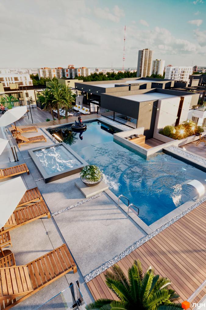 Житловий комплекс SKYLINE з басейном та зоною відпочинку на даху, оточений міською забудовою та зеленню.