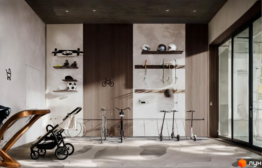 Інтер'єр приміщення для зберігання спортивного інвентарю в ЖК Lypynsky. Стіни оздоблені деревом та штукатуркою, на підлозі килим з незвичайним візерунком.