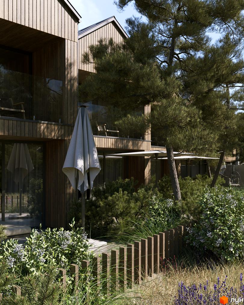 Котеджне містечко КМ Migovo Ski & SPA з дерев'яним фасадом та зеленою прибудинковою територією з деревами та кущами.