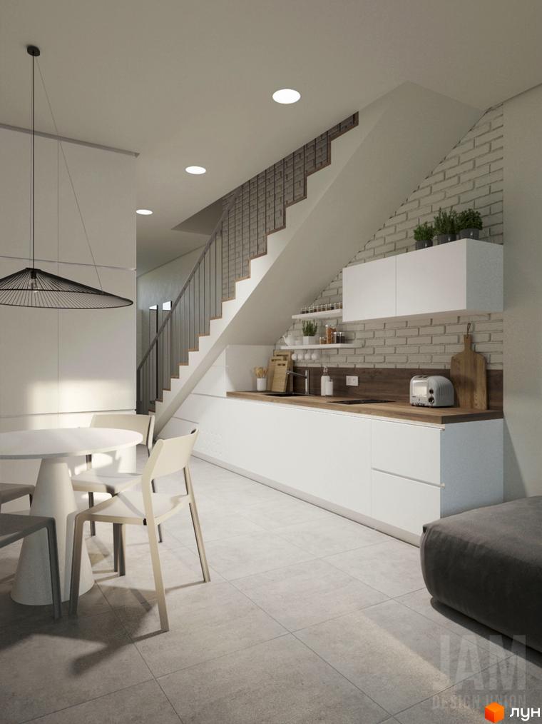 Інтер'єр кухні-вітальні з білими меблями та дерев'яною стільницею, що виходить до сходів. КМ Migovo Ski & SPA - новобудова для комфортного життя.