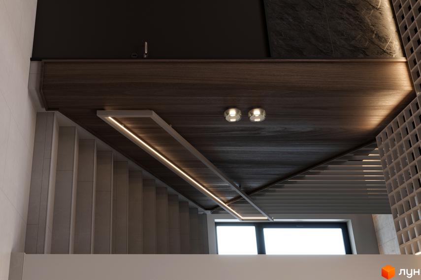 Інтер'єр житлового комплексу CONTINENT CLUB з дерев'яним оздобленням стелі та вбудованим освітленням. Сходи ведуть до вікон.