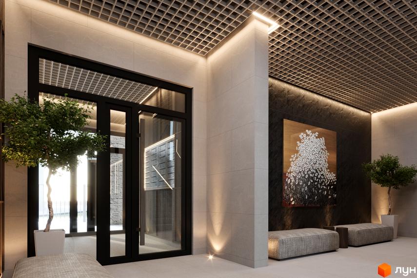 Вхідна група житлового комплексу CONTINENT CLUB з елегантним дизайном та арт-об'єктом на стіні. Просторий хол з зручними місцями для відпочинку.