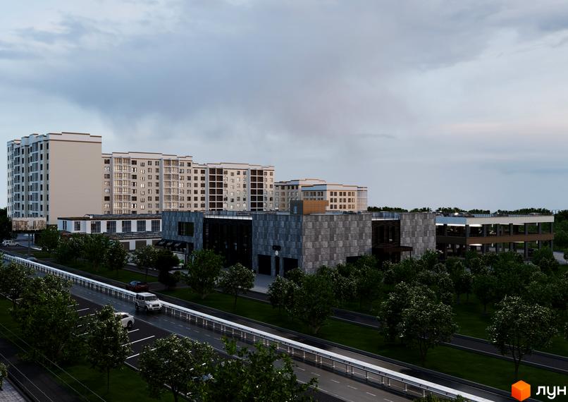 Зовнішній вигляд житлового комплексу Олімп Модерн з багатоповерховими будинками та паркінгом, поруч дорога з автомобілями та зелені насадження.