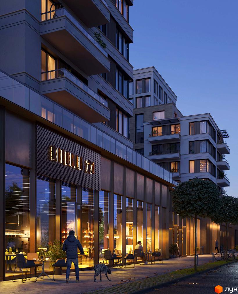 Фасад будівлі житлового комплексу OLEGIV Boutique Residence з великими вікнами та балконами. На вулиці видно людей, що прогулюються, та дерева.