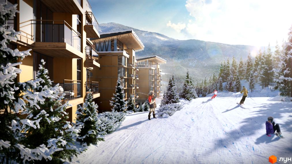 Апарт-готель VELMY: фасади будівель з балконами та панорамними вікнами на тлі засніжених гір та соснового лісу. На схилі біля будівель катаються на лижах люди.