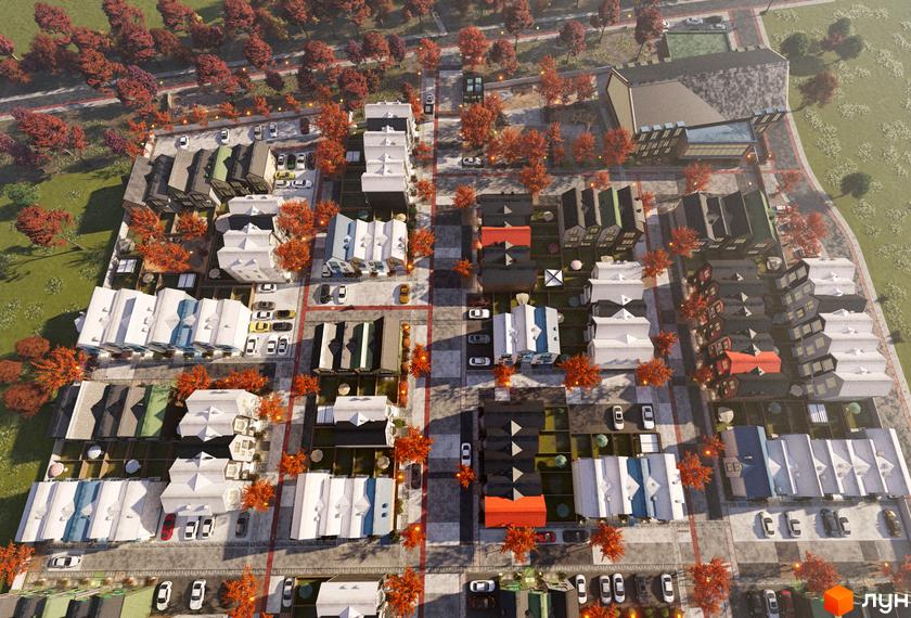 Таунхауси Sвій Dім 3: вид зверху на житловий комплекс з акуратними будинками та доглянутою прибудинковою територією з деревами.