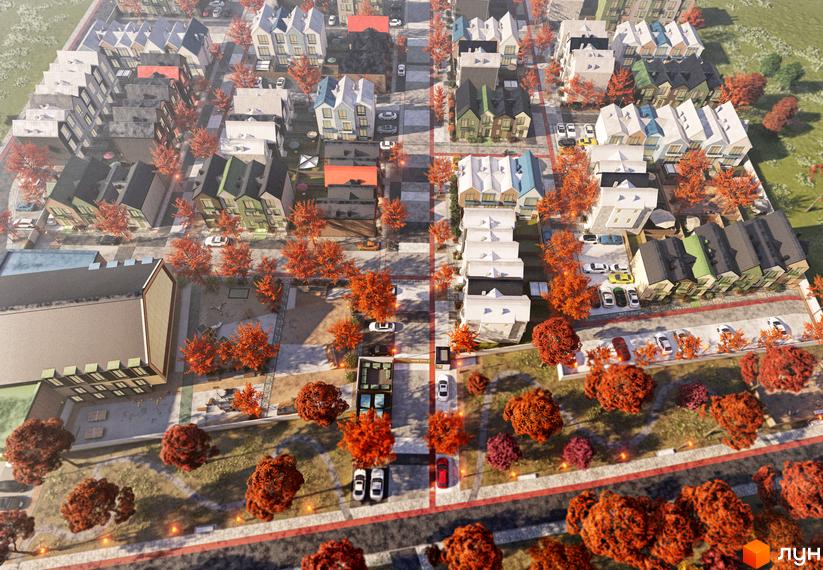 Таунхауси Sвій Dім 3: вид зверху на житловий комплекс з цегляними фасадами та осінніми деревами.