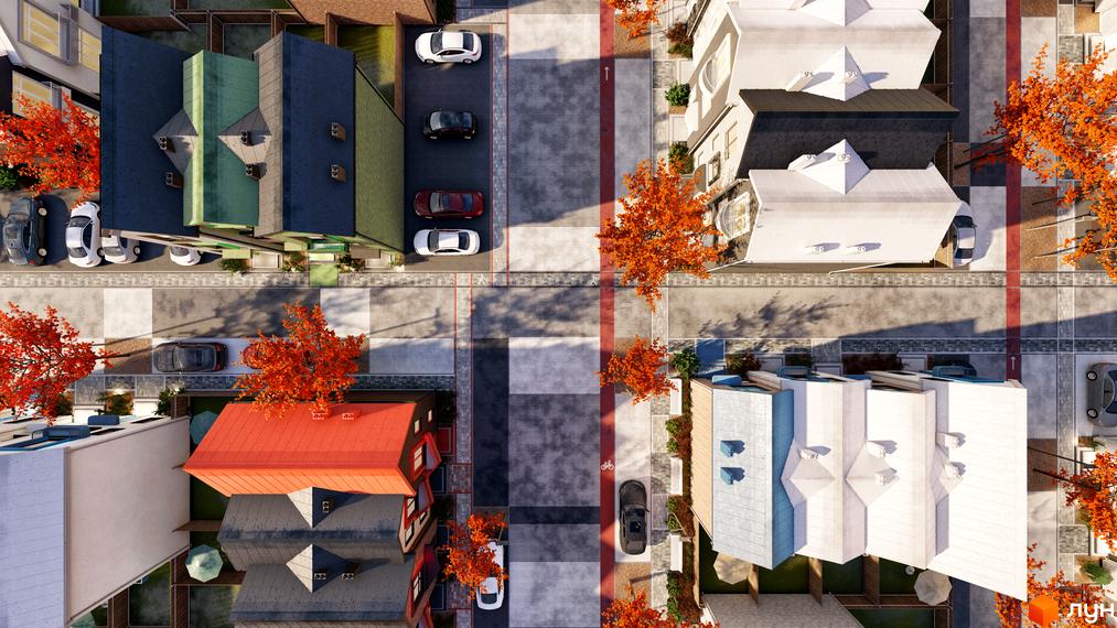 Вид зверху на таунхауси Sвій Dім 3 з червоними дахами та осінніми деревами. Навколо новобудови розташовані дороги та припарковані автомобілі.