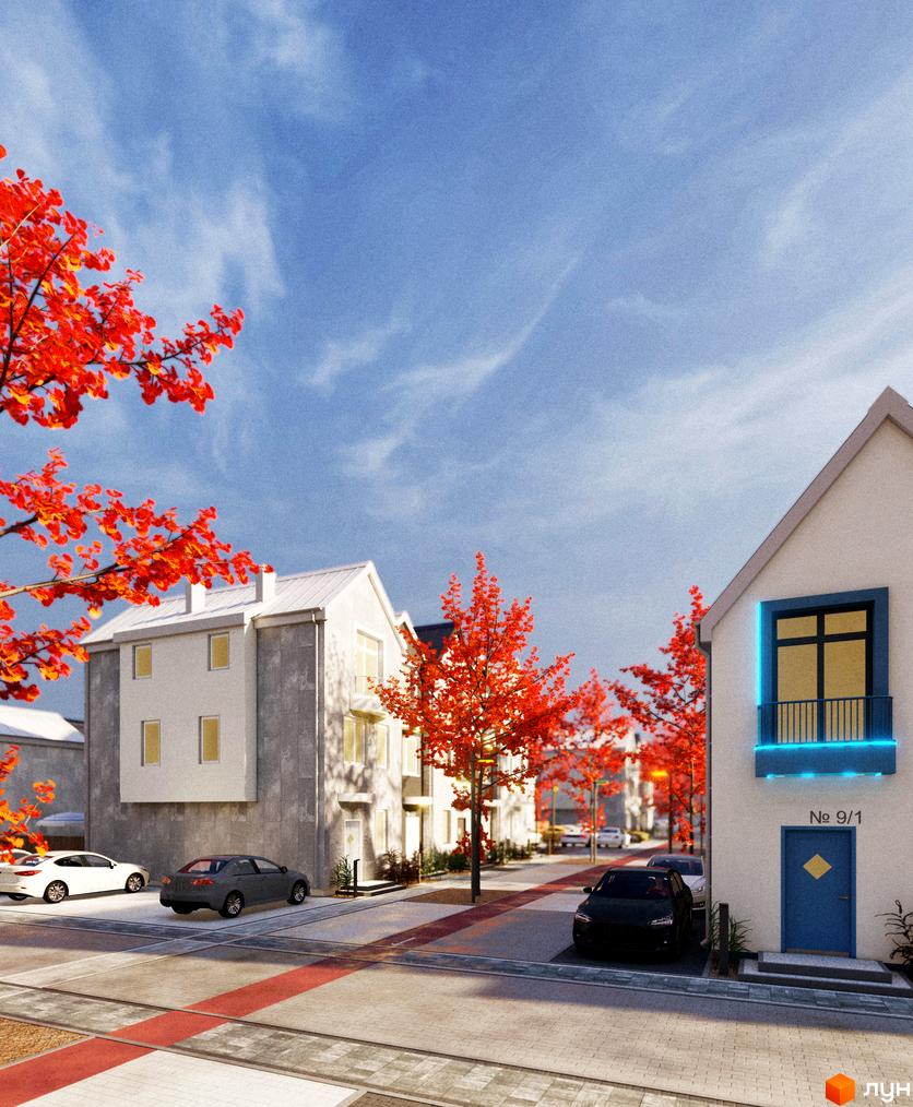 Таунхауси Sвій Dім 3: фасади білих будинків з сірими елементами та червоно-оранжеве листя дерев на тлі блакитного неба. Прибудинкова територія з автомобілями.