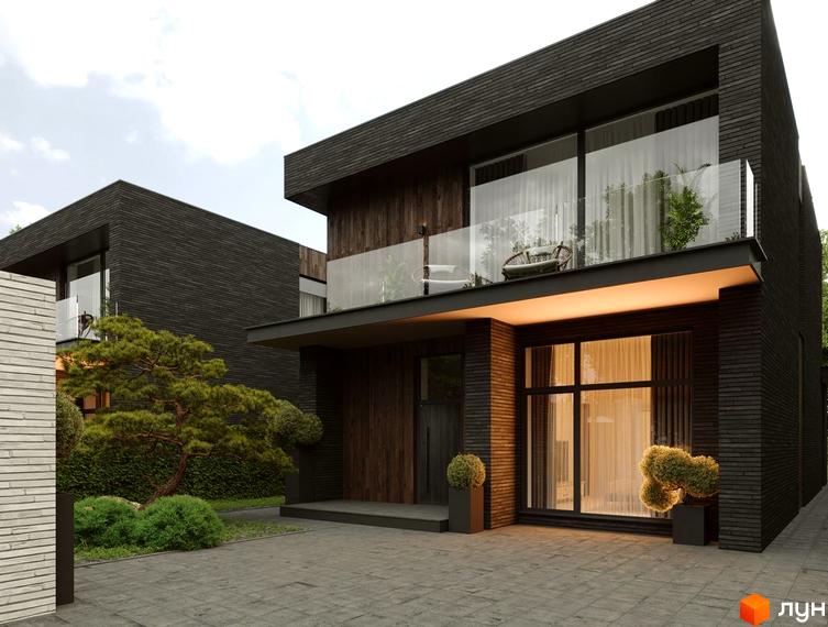 Двоповерховий будинок з темною цегляною обробкою, скляним балконом та великими вікнами. На території Містечко котеджів BritanHouse висаджені декоративні рослини та викладена бруківка.