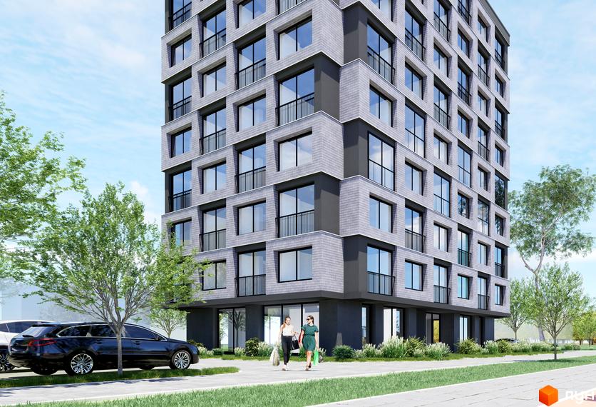 Житловий комплекс BRAVE з сірим фасадом та великими вікнами, поруч зелені дерева та припарковані автомобілі.
