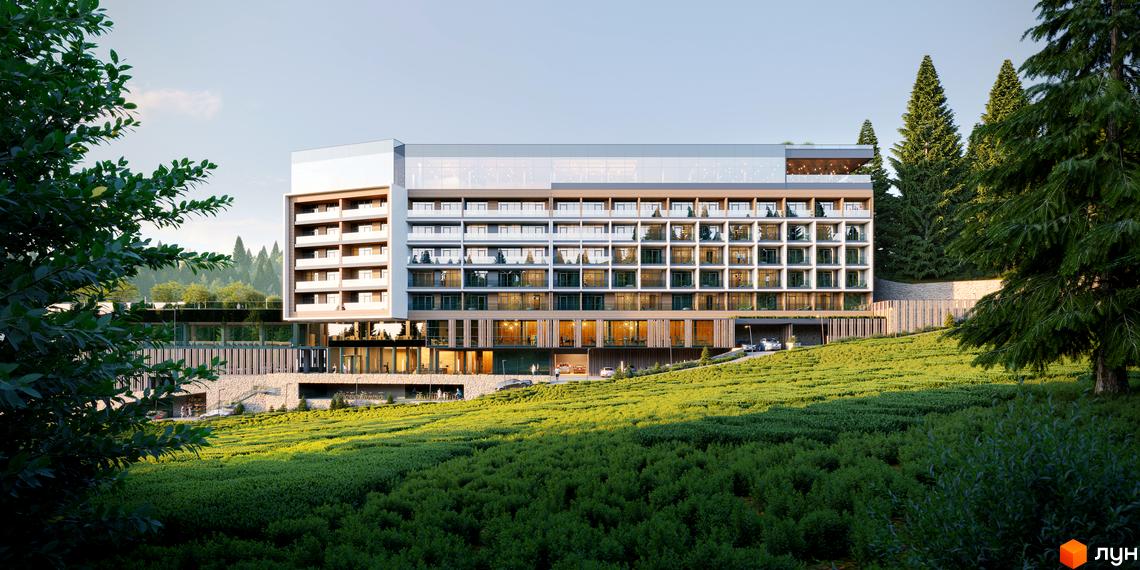 Багатоповерхова будівля GRAND SPA RESORT AND CONFERENCE з балконами та великими вікнами, оточена зеленими насадженнями та хвойними деревами.