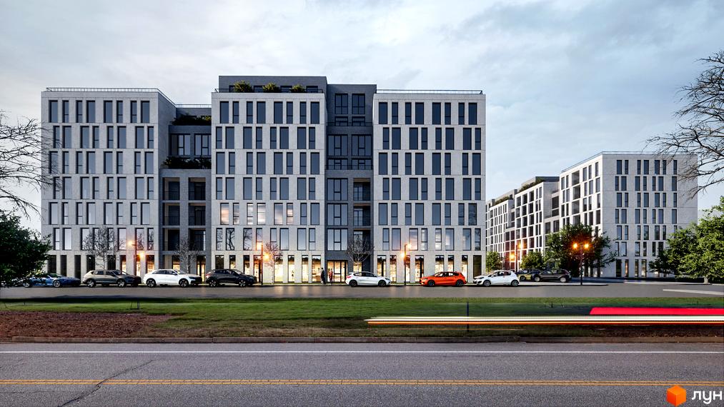 Житловий комплекс Art deluxe. Сучасна архітектура з великою кількістю вікон та балконів, перед будинком розташована зелена зона та дорога з автомобілями.