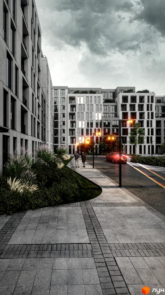Житловий комплекс Art deluxe з сірими фасадами та великими вікнами, упорядкована прибудинкова територія з пішохідною доріжкою та зеленню.