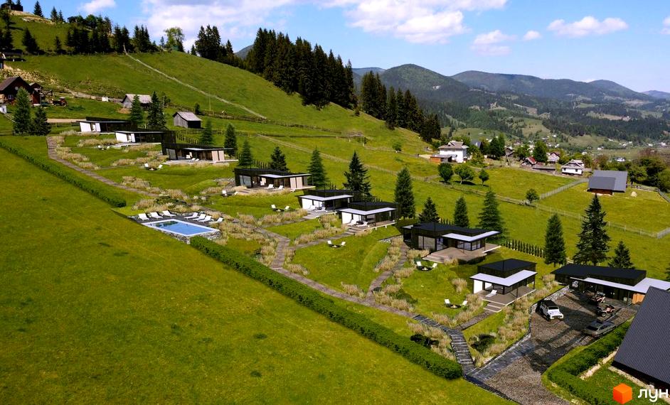 Котеджне містечко КМ BARVY на схилі гори з басейном та сучасними будинками, оточене зеленню та гірськими пейзажами.