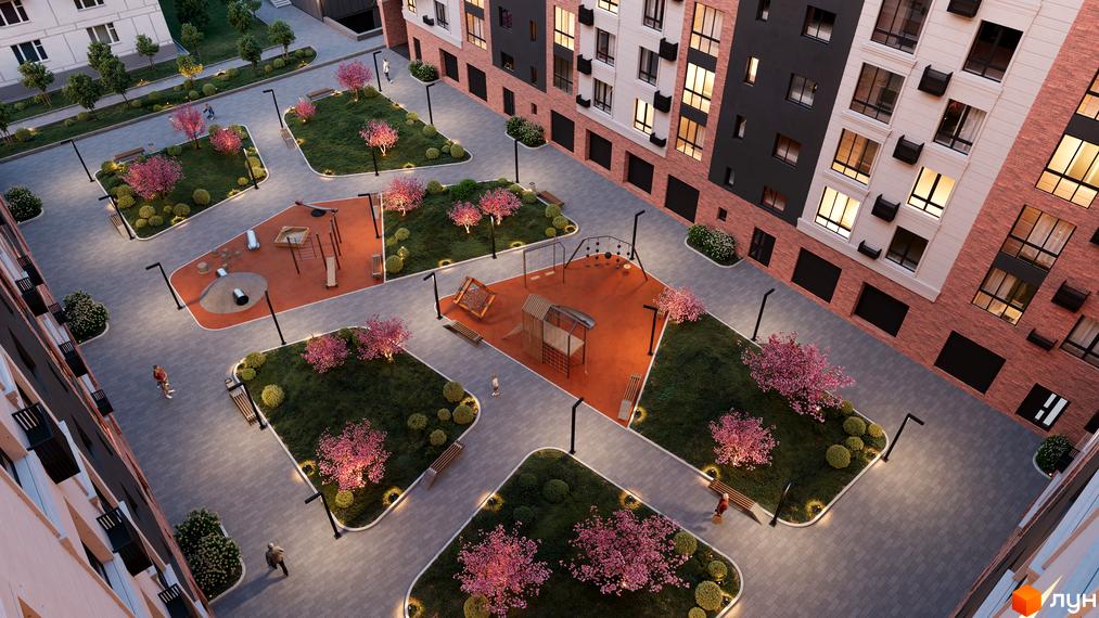 Житловий комплекс Магнолія Парк з дитячим майданчиком та зоною відпочинку. Зелена прибудинкова територія з деревами та лавками.