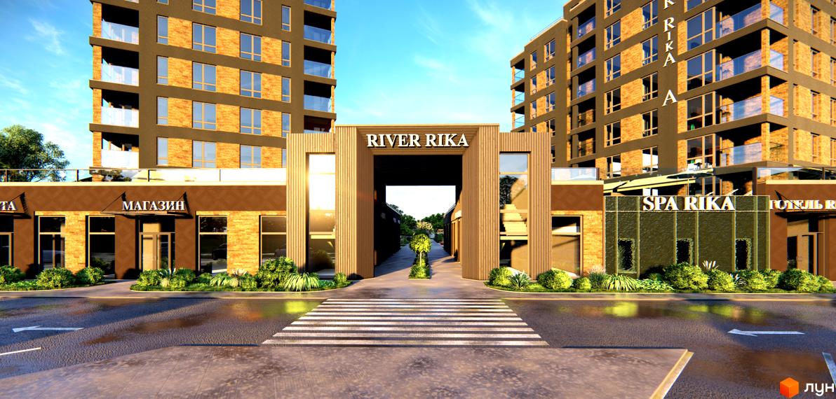 Зовнішній вигляд новобудови River Rika з магазинами та спа-центром. Прибудинкова територія з пішохідним переходом та зеленими насадженнями.