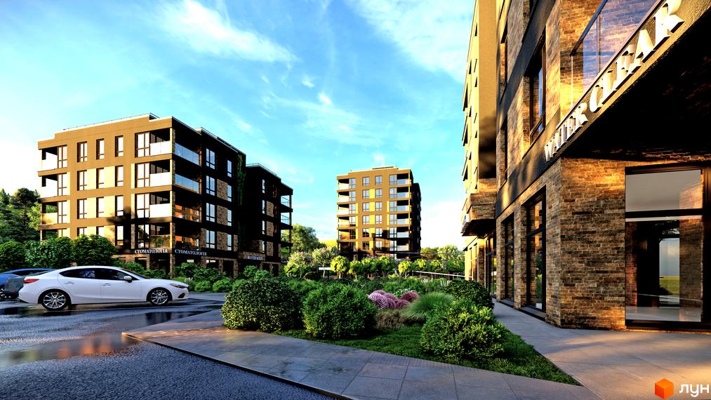 Житловий комплекс River Rika з цегляним фасадом та скляними балконами. Навколо комплексу зелені насадження та доглянута прибудинкова територія.