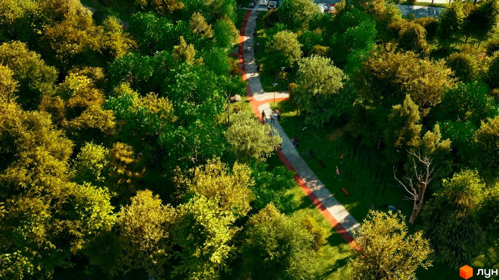 Паркова зона ЖК Sense City з доріжками, деревами та місцями для відпочинку. Зелена територія комплексу для прогулянок та активного дозвілля.