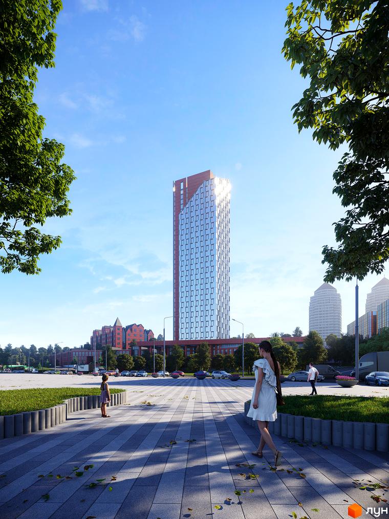 БФК MAYAK - висотна новобудова з цегляним фасадом та скляними вікнами, що виходить на облаштовану прибудинкову територію з зеленими насадженнями та пішохідними доріжками.