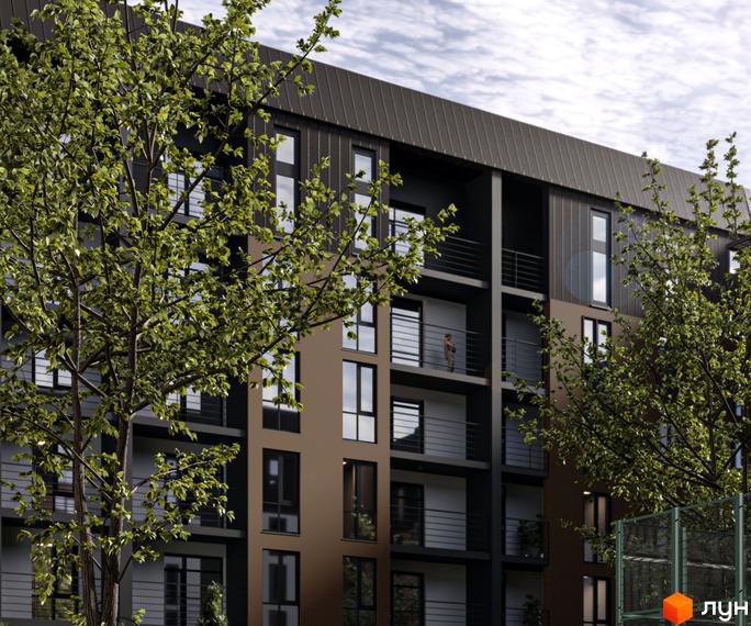 Зовнішній вигляд новобудови ЖК Дружній Двір з фасадом з коричневих та чорних панелей, вікнами та балконами. Навколо ростуть дерева, видно спортивний майданчик.