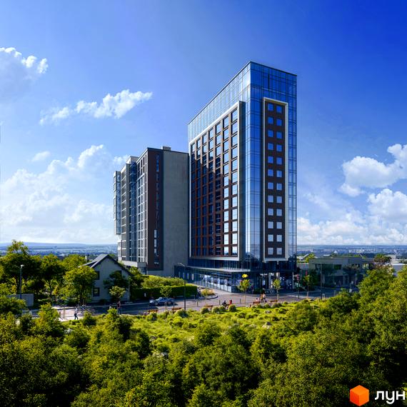 Зовнішній вигляд житлового комплексу The Five Hotel з скляним фасадом та цегляними вставками, оточений зеленою зоною з деревами та доглянутою територією.