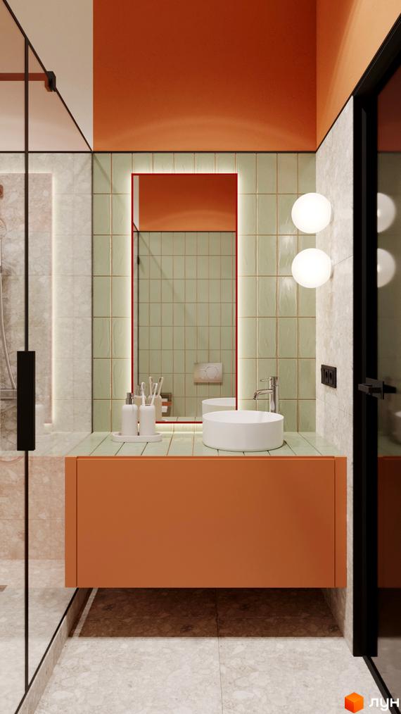 Інтер'єр ванної кімнати з помаранчевими меблями, круглим умивальником та світлодіодним підсвічуванням навколо дзеркала. На стінах плитка.
