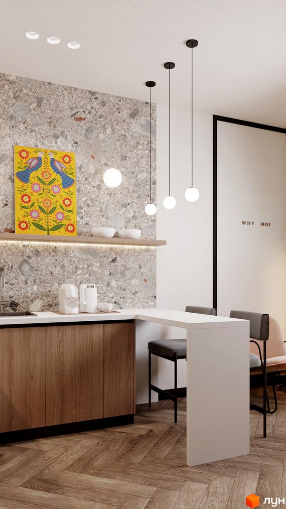 Інтер'єр кухні в апарт-готелі. Сіра стіна з декоративним панно, дерев'яні меблі, барна стійка з двома стільцями та підвісні світильники.