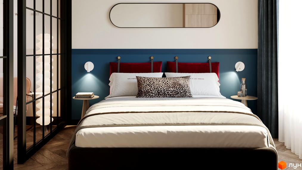 Інтер'єр спальні в апарт-готелі. Ліжко з червоним узголів'ям, декоративними подушками та приліжковими тумбочками з лампами.