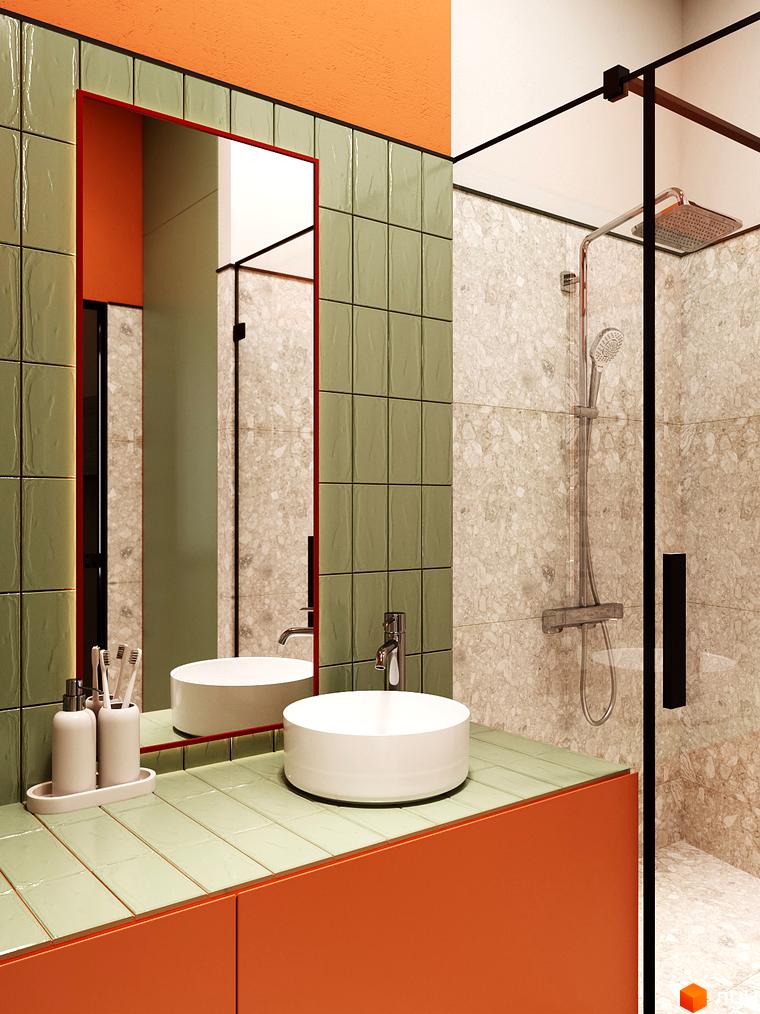 Інтер'єр ванної кімнати з круглим умивальником, дзеркалом з червоною рамкою та душовою кабіною з прозорого скла. Переважають помаранчевий та зелений кольори.