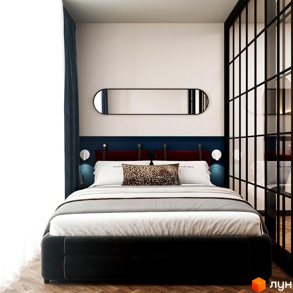 Інтер'єр спальні в апарт-готелі WOL Vinnytsia. Ліжко з декоративними подушками, дзеркало на стіні, скляна перегородка.