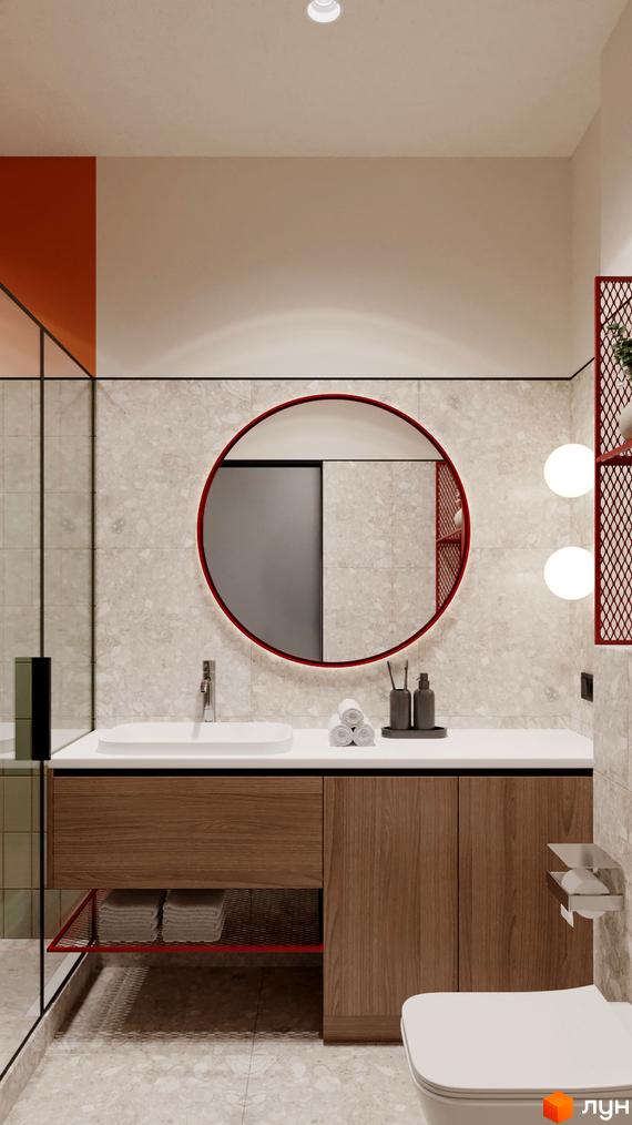 Інтер'єр ванної кімнати з круглим дзеркалом, тумбою з деревини та білою сантехнікою. На стінах плитка під камінь, поруч полички з рослинами.