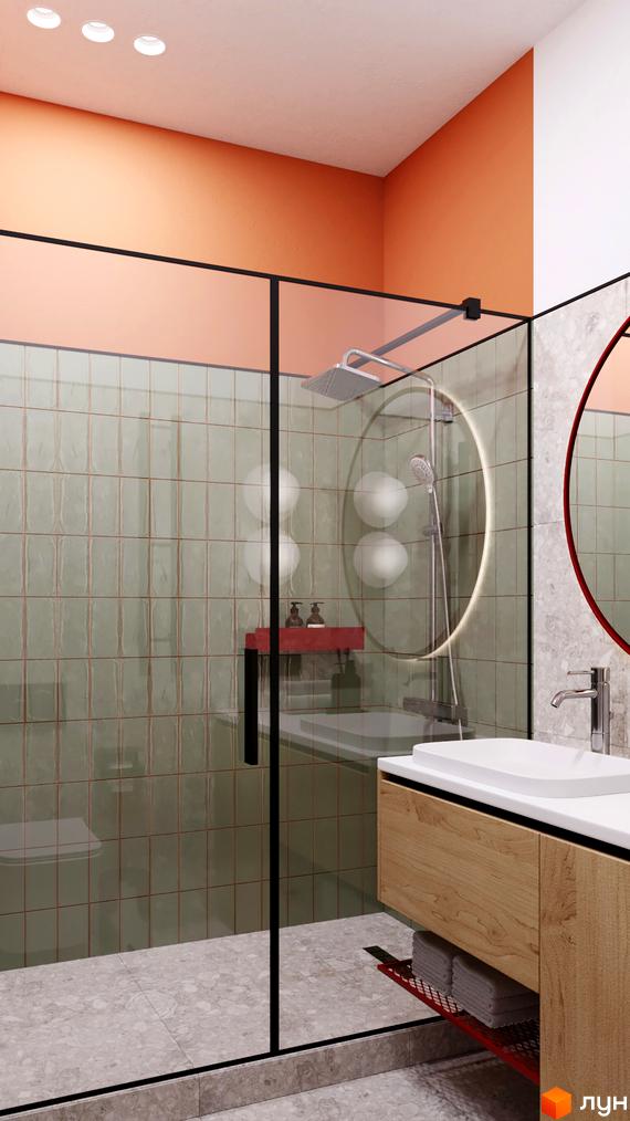 Інтер'єр ванної кімнати з душовою кабіною, умивальником та дзеркалом. Стіни оздоблені плиткою, переважають світлі тони.