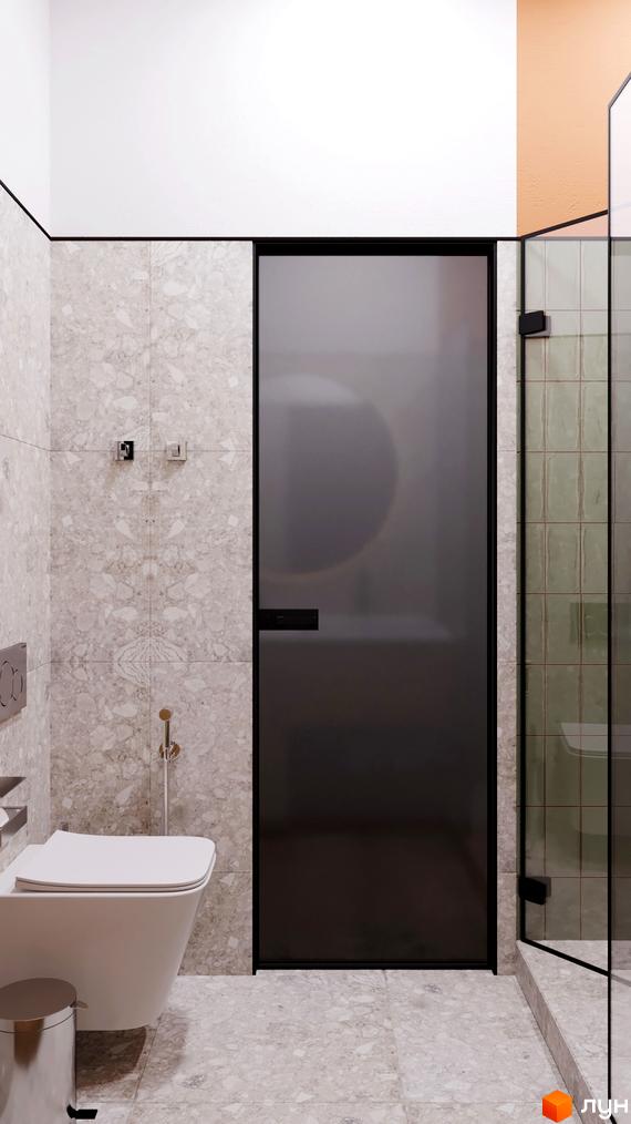 Інтер'єр ванної кімнати в апарт-готелі WOL Vinnytsia. Сіра плитка, душова кабіна зі скляними дверцятами, туалет.