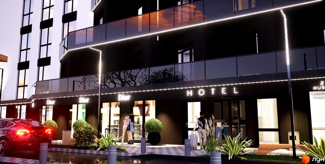 Зовнішній вигляд апарт-готелю WOL Vinnytsia з підсвіткою та входом, біля якого стоять люди. На передньому плані тротуар та рослини.