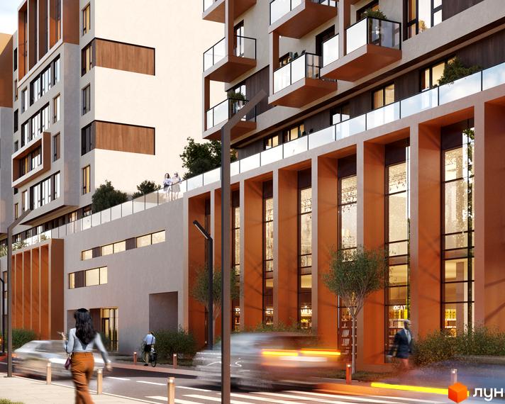 Фасад Житлового комплексу For Life з теракотовими елементами та великими вікнами. Перед будинком вулиця з пішоходами та зеленими насадженнями.