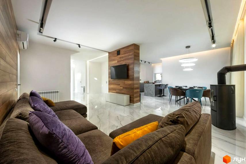 Дизайн вітальні з диваном, каміном та обідньою зоною. Сучасний інтер'єр квартири в новобудові КМ Парк хаус.