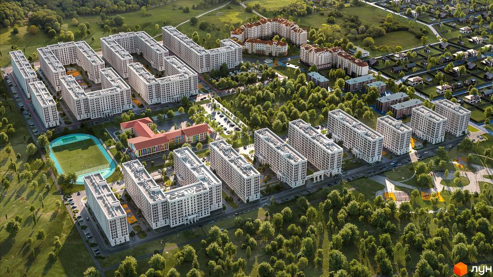 Житловий комплекс OXFORD з білими багатоквартирними будинками та зеленою прибудинковою територією зі спортивним полем. Огляд новобудови з висоти пташиного польоту.