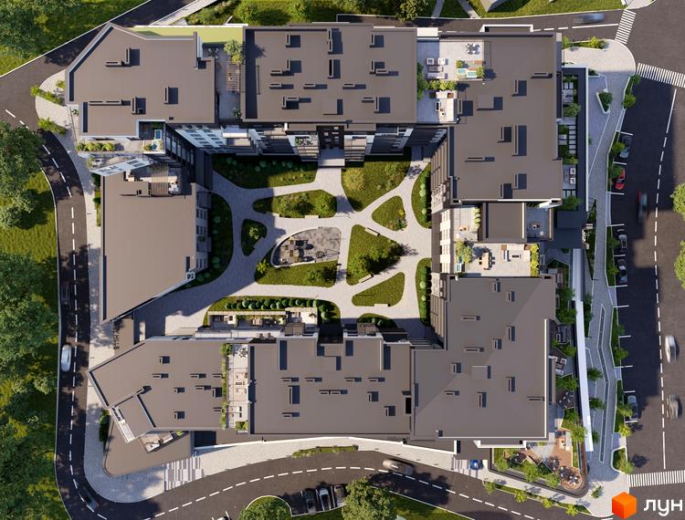 Вид зверху на житловий комплекс Grand Hills з внутрішнім двором та зеленими зонами. Комплекс має багатоповерхові будівлі з пласкими дахами та прибудинкову територію з доріжками та місцями для відпочинку.