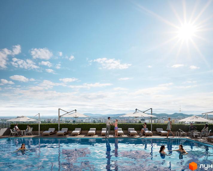 Житловий комплекс Viking Hills: басейн з шезлонгами та парасолями на даху, вид на місто та гори. Відпочинок біля басейну з сім'єю.