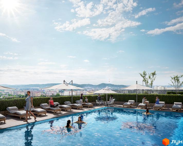 Житловий комплекс Viking Hills з басейном та зоною відпочинку на даху. Відкривається вид на місто та гори.