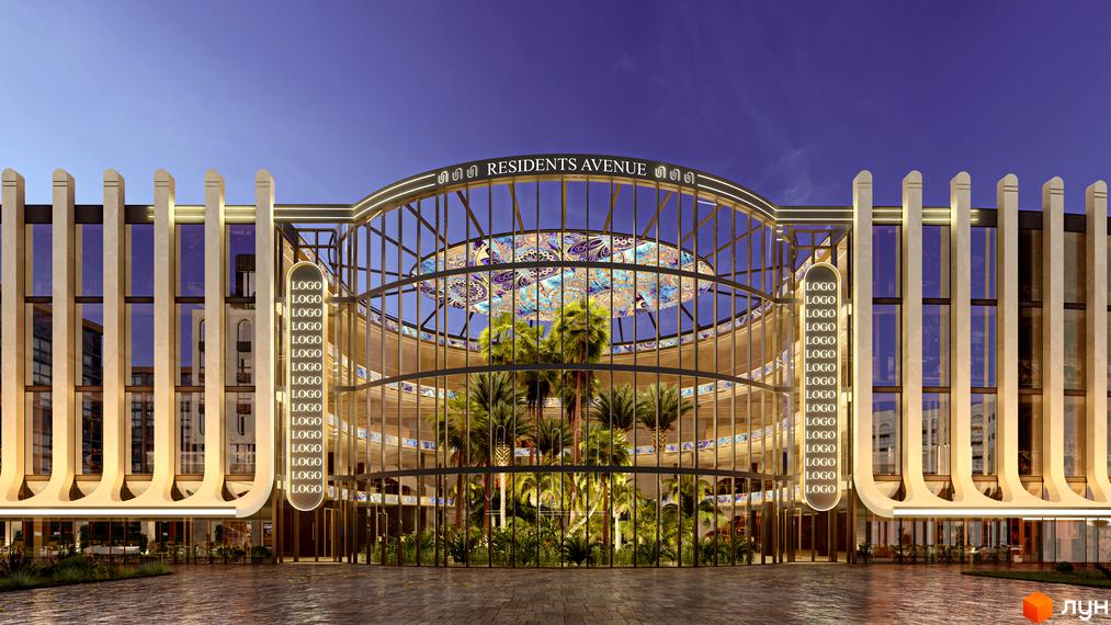 Зовнішній вигляд комплексу RESIDENTS AVENUE з центральним скляним куполом та пальмами. Фасад оздоблений вертикальними колонами та підсвічуванням.