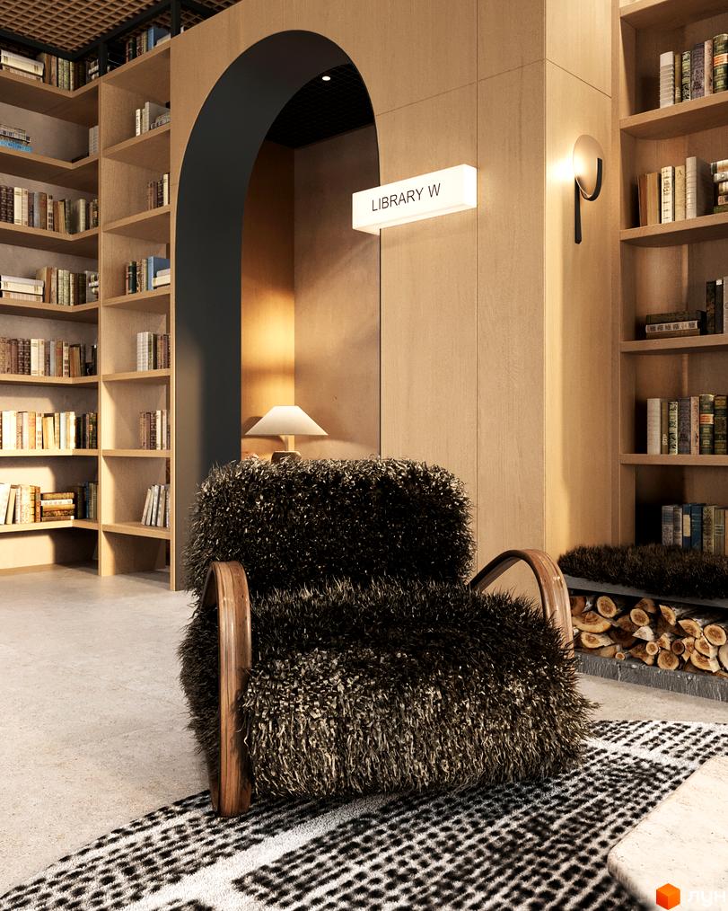 Інтер'єр бібліотеки в житловому комплексі Erwin Hall з м'яким кріслом та книжковими полицями. Затишна атмосфера для читання та відпочинку.