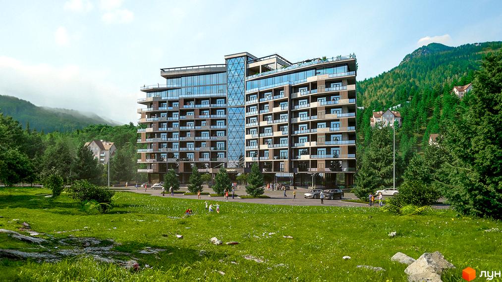 KARDAMON RESORT & SPA - комплекс з багатоповерховими будівлями та балконами, розташований серед зелених гір та дерев. Навколо комплексу - доглянута прибудинкова територія з газоном та людьми.