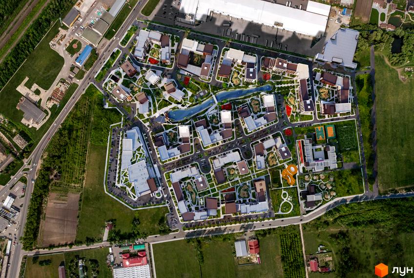 Зображення зверху на Житловий район Paradise Avenue з будівлями, дорогами та зеленими насадженнями. На території є озеро, дитячі майданчики та спортивні зони.