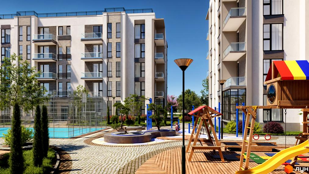 Житловий комплекс MISTO: фасади будівель з балконами та дитячий майданчик з басейном на прибудинковій території.