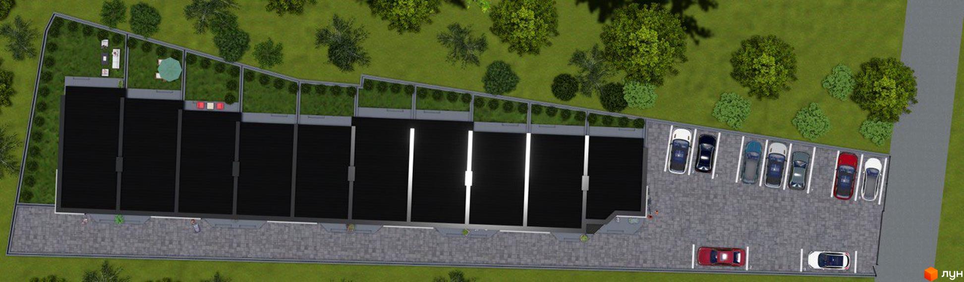 Вигляд зверху на Таунхауси Belissimo з темними дахами, індивідуальними зеленими подвір'ями та паркінгом.