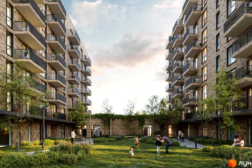 Житловий комплекс WABI 2 з цегляним фасадом та балконами. На прибудинковій території зелений двір з деревами та людьми.